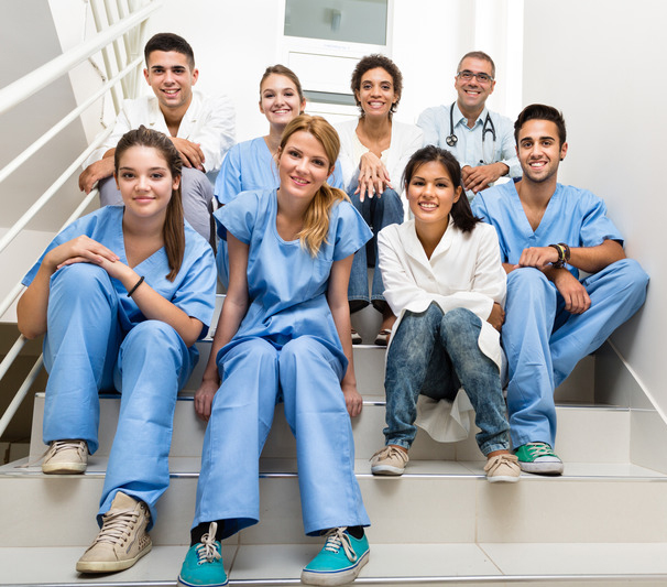 Medical students and team Group of medical students and teacher sitting on the stairs.